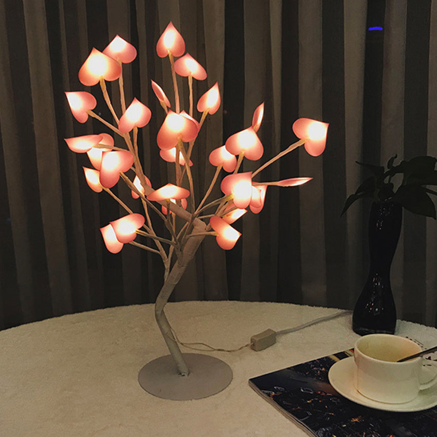 LED Night Light Fairy Lights shaped like cherry blossoms on a white tree stand, ideal for kids' bedroom or home decor. USB-powered for safe, cozy lighting.